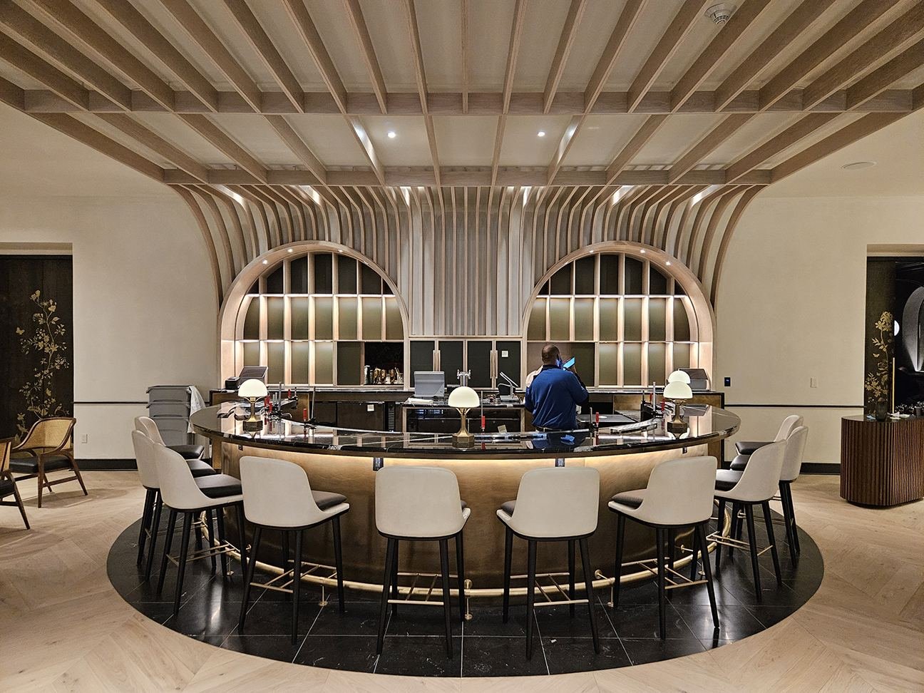 Lobby bar — bar service area with arched display shelving