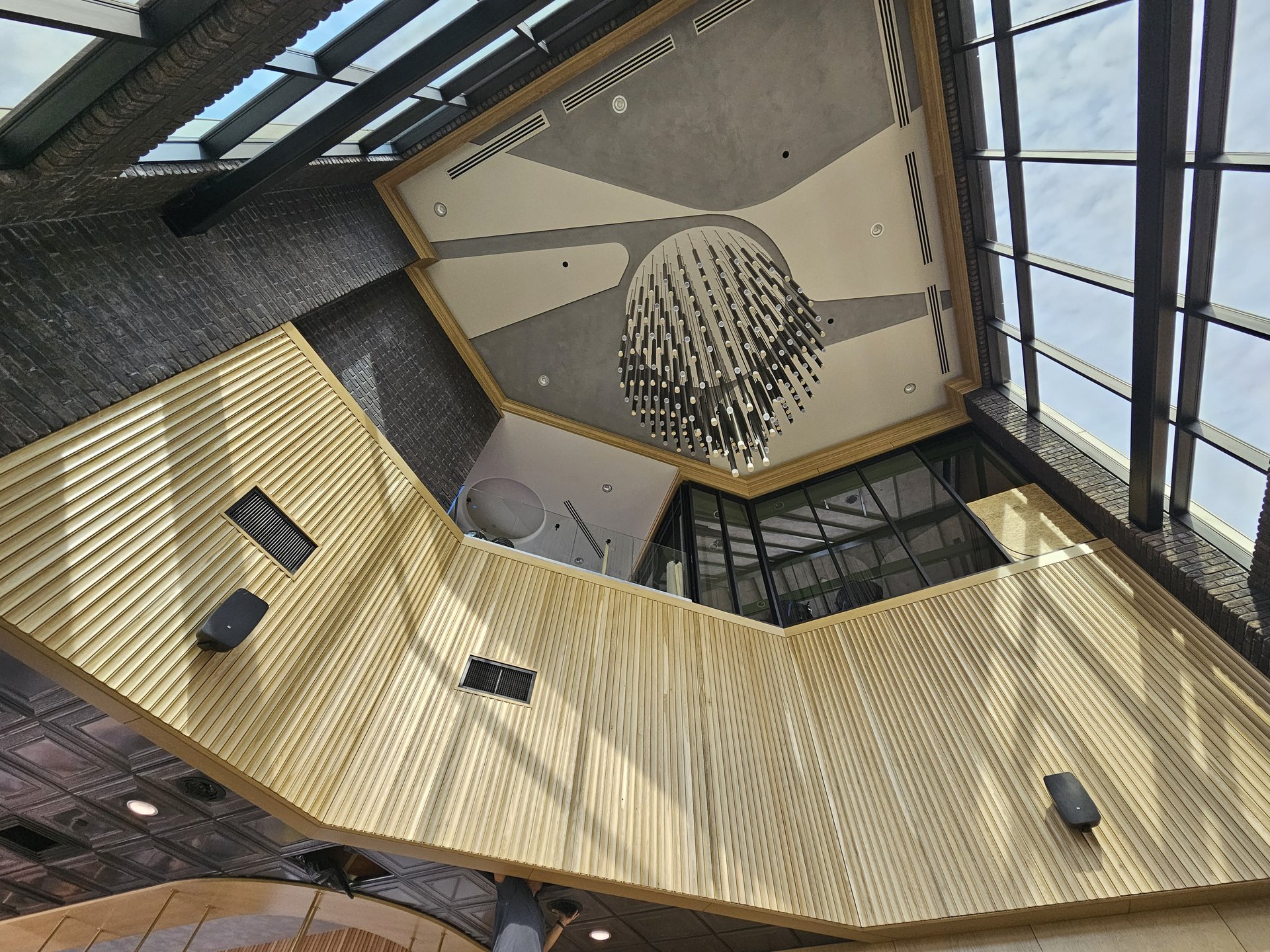 Ruth’s Chris Steakhouse — atrium millwork ceiling and chandelier overhead view